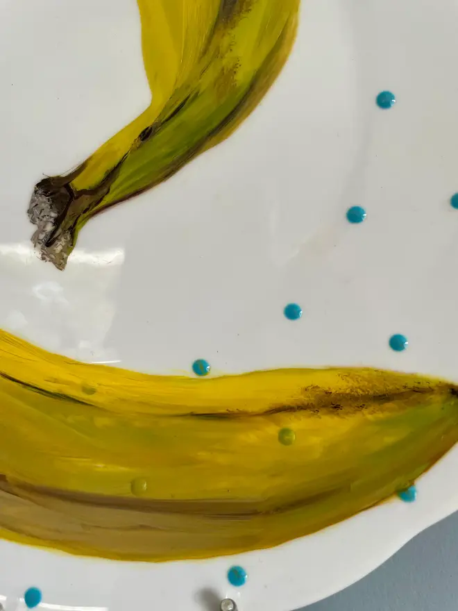 Zoom-in on Oil Painted Banana On Vintage Cake Plate. 