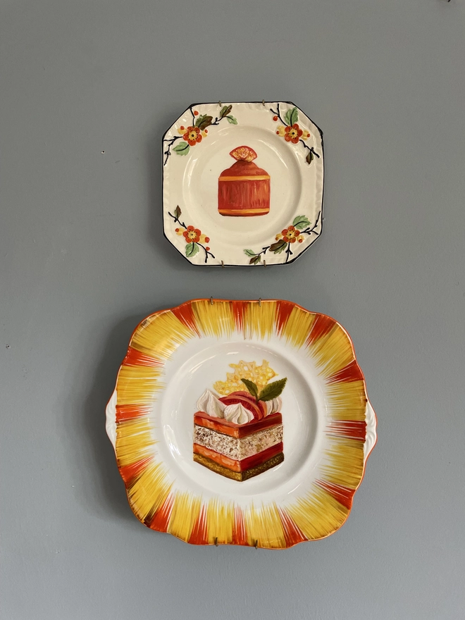 2 orange plates on wall