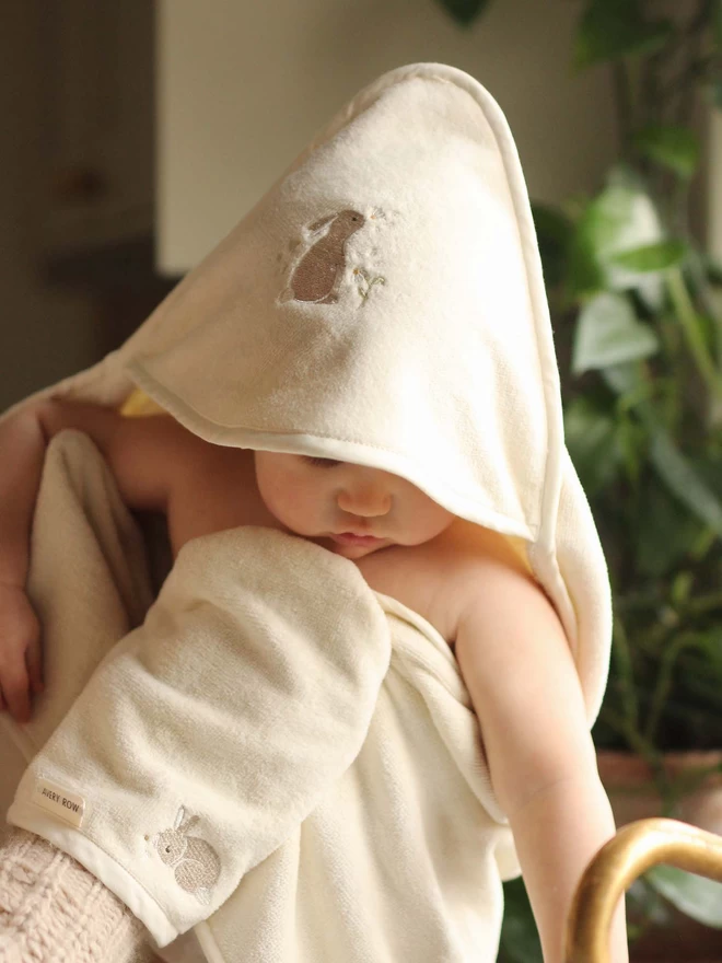 Baby wearing the cutest hooded towel baby during bath time