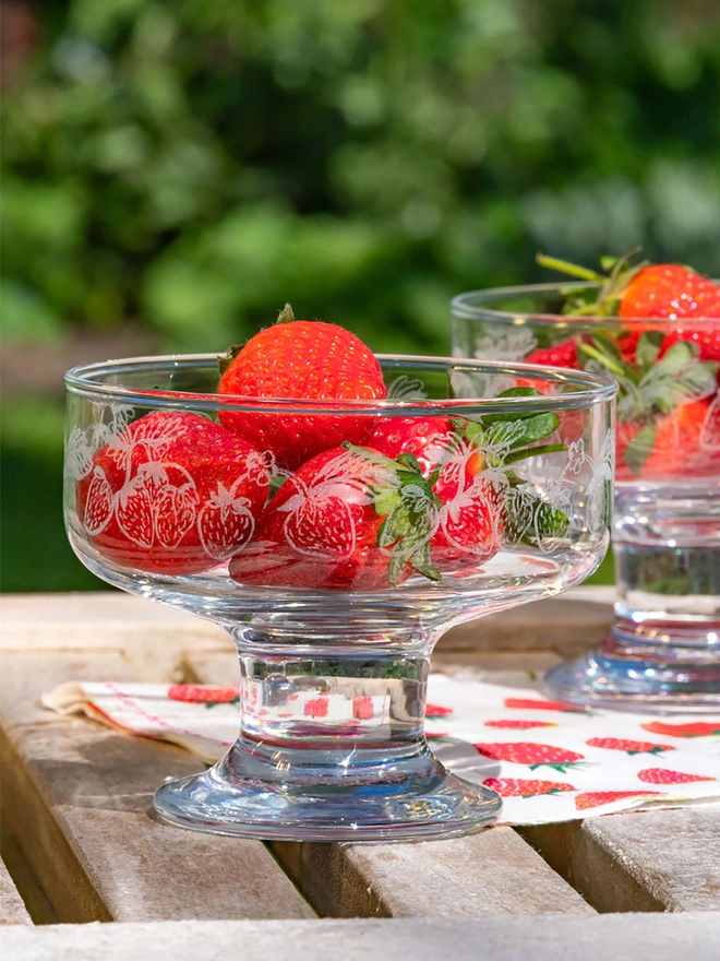 Strawberry design etched glass dessert bowls filled with strawberries