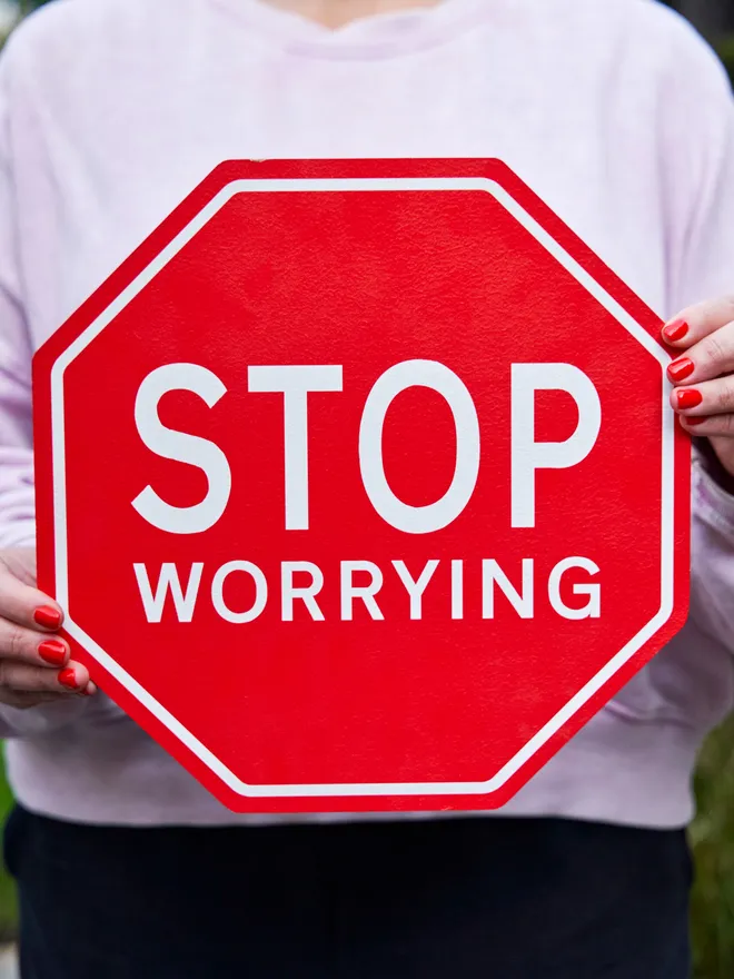 Stop worrying sign