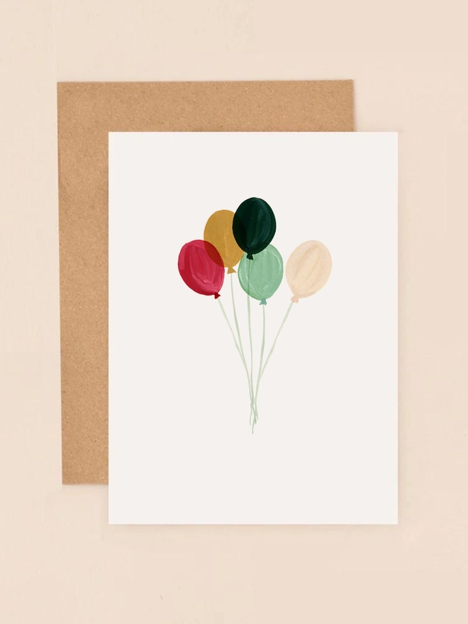A vibrant illustration featuring a cluster of colorful balloons in shades of red, yellow, green, and blue, floating against a soft, neutral background. The balloons are depicted in a loose, hand-painted style, conveying a sense of lightness and celebration. The design is minimalist and cheerful, perfect for conveying joy and well wishes.
