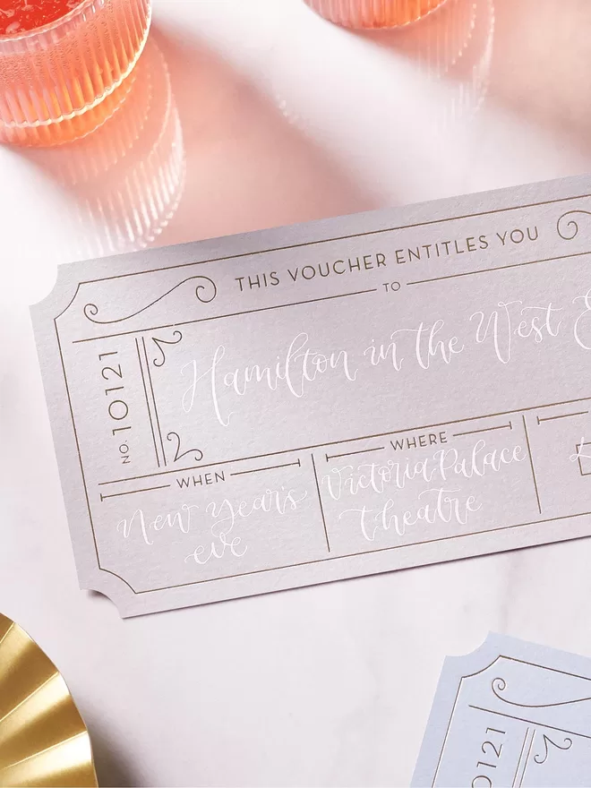 grey and white personalised golden ticket for concert surprise reveal