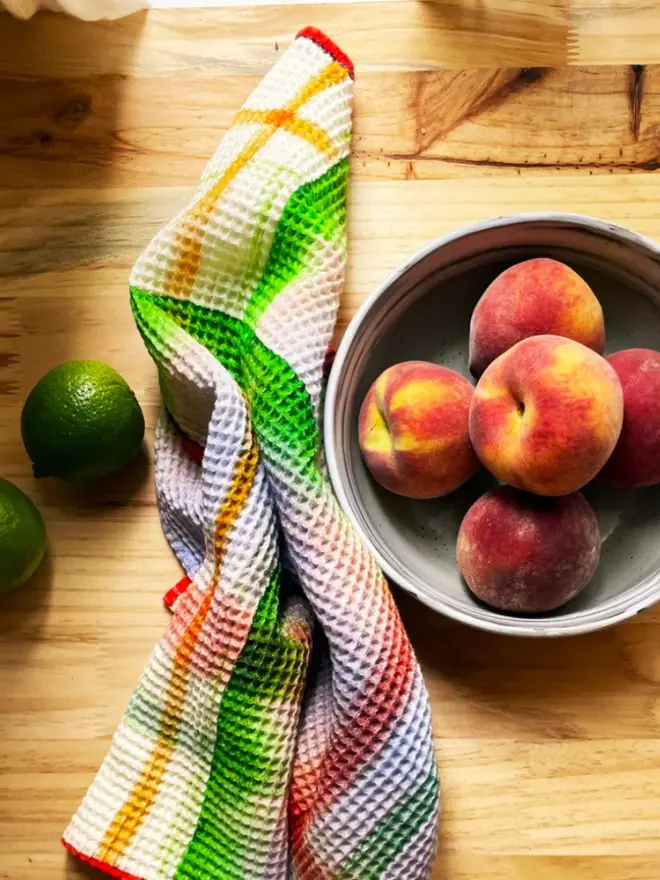 Check Waffle Tea towel, next to a bowl of fruit. 
