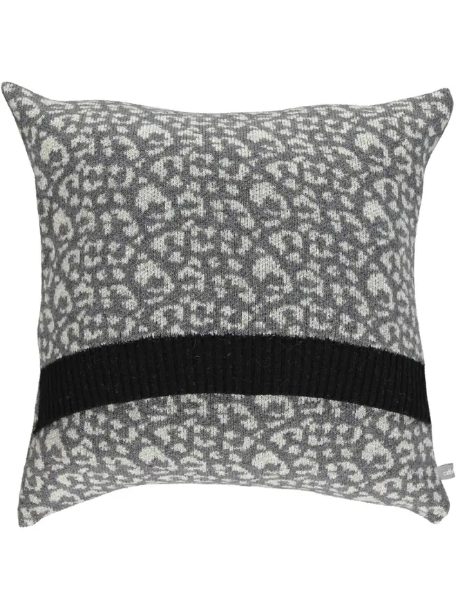 Lambswool Patterned Cushion, a cushion sitting on a plain white surface. 