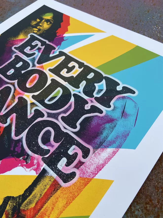 Vibrant "Everyb "Everybody Dance" Hand Pulled Screen Print  square with lady in back ground dancing amongst different shade of colour blue back ground and the words everybody dance printed on top  ody Dance" screenprint with colorful dancing silhouettes and bold typography, exuding energy and movement.