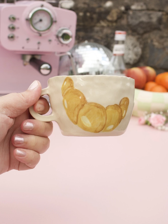 handmade stoneware pottery mug with handpainted croissant