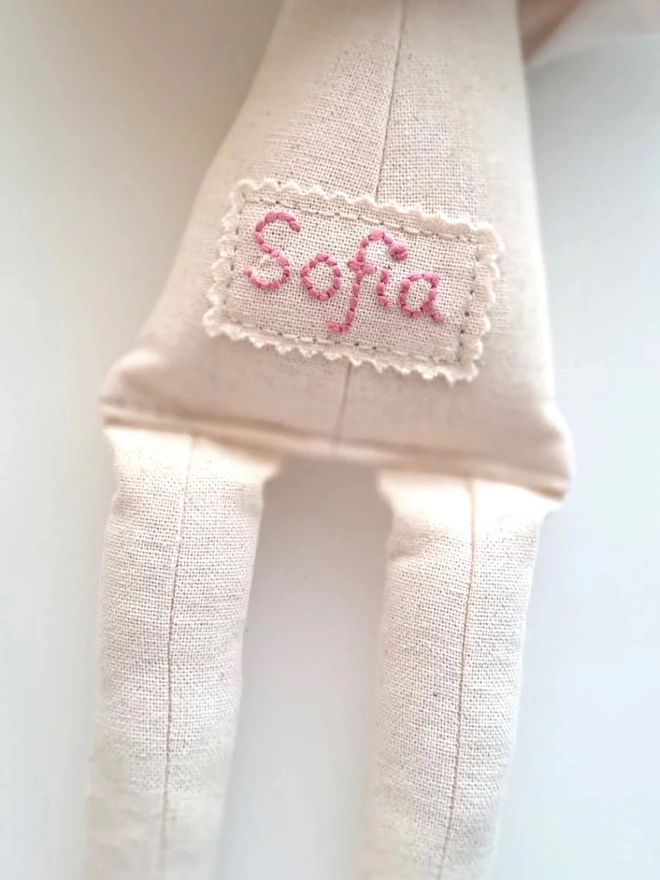 handmade heirloom linen bunny. a personalised embroidered name on a soft toy rabbit.
