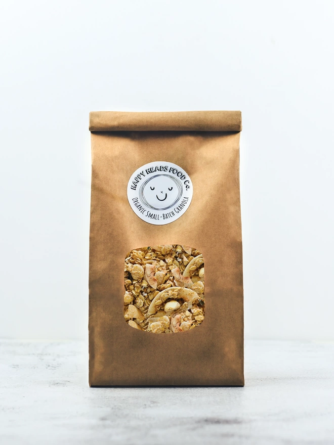 Happy Heads 'Cinnamon & Macadamia' granola in a medium (600 g) refill bag