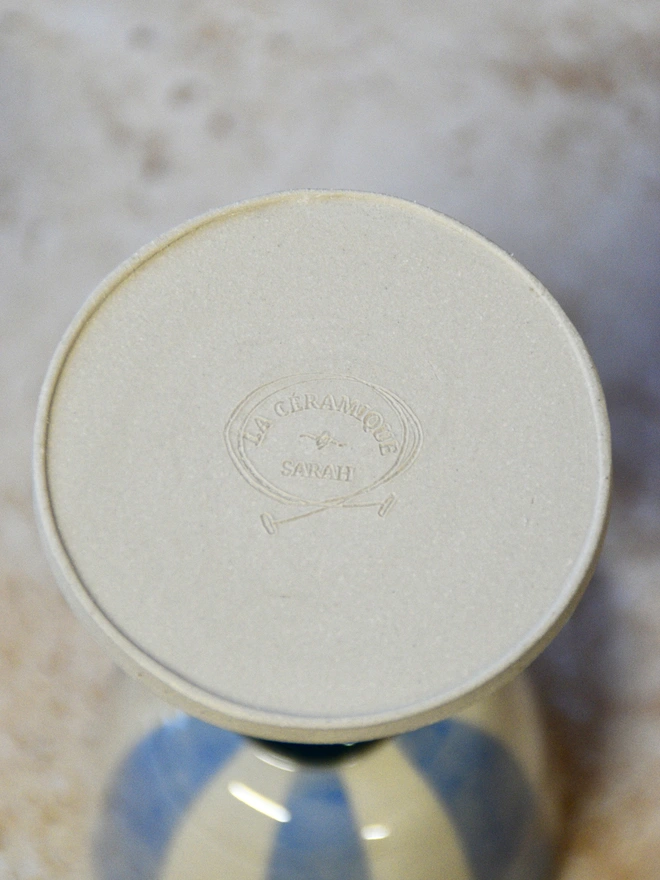 Underside view of a handmade ceramic wine cup, highlighting the circular base and hand-finished details.