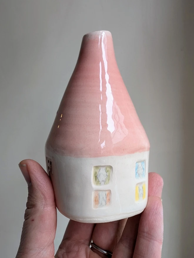 bud vase with a pink roof and coulourful windows small ceramic pottery bud vase