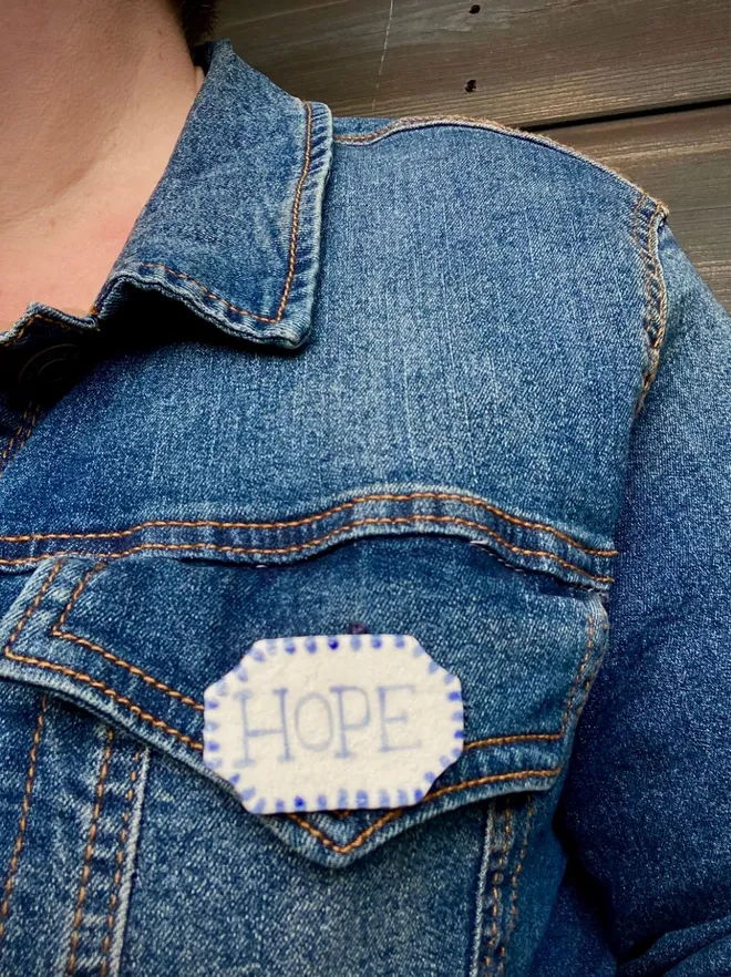 hope badge on jacket