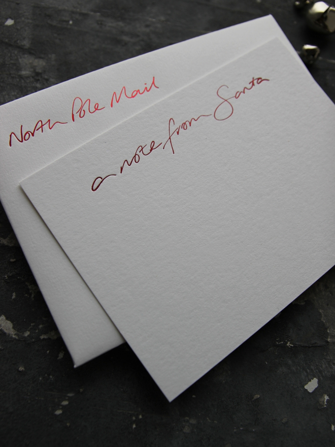 Notecards hand foiled in red says A Note From Santa with an envelope that says North Pole Mail
