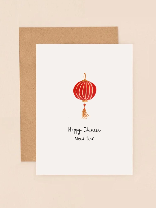 A vibrant illustration featuring a traditional Chinese New Year symbol, a stylised red lantern with gold accents. The intricate design captures the festive spirit of the celebration. The front of the card reads "Happy Chinese New Year" in elegant black lettering. This mini card is perfect for sending warm wishes and celebrating the start of a prosperous new year.