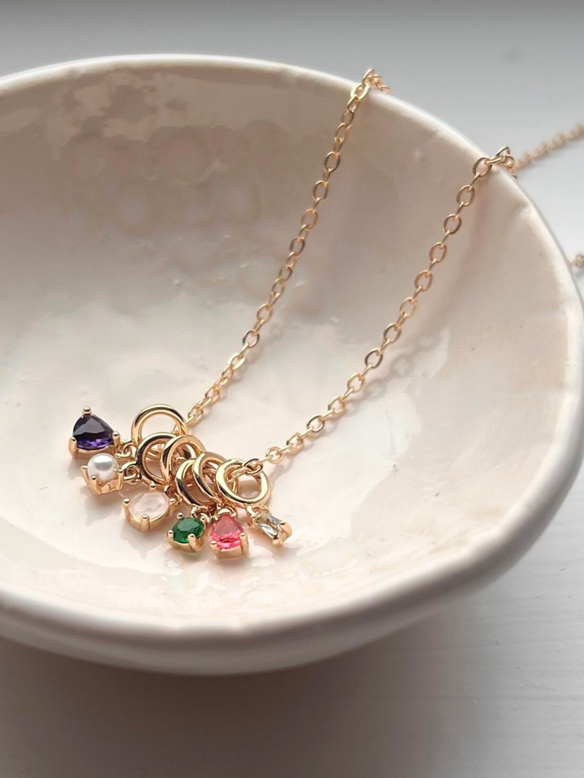 birthstone bracelet in dish on super fine gold trace chain