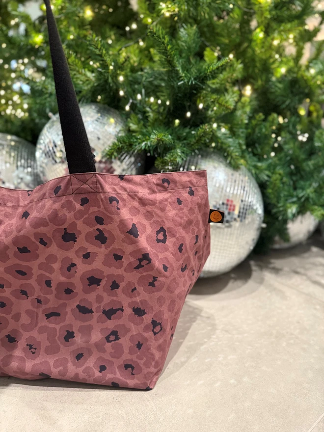 Mocha Contents Bag next to Christmas Tree and disco balls