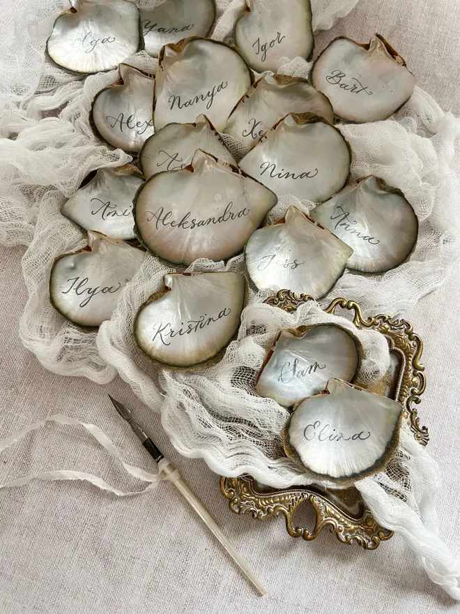 Calligraphy oyster shell place cards