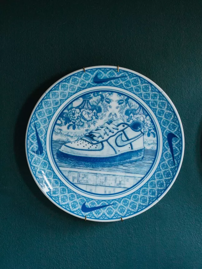 Nike Air Force One Plate seen hanging on a blue wall.