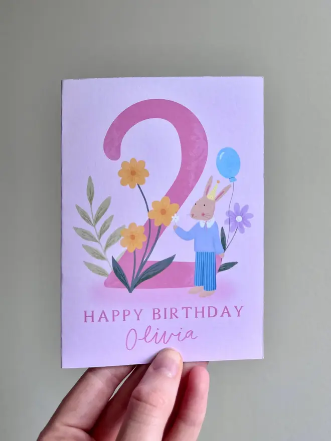 personalised floral 2nd birthday card. pink 2nd birthday card with illustrated rabbit and flowers.
