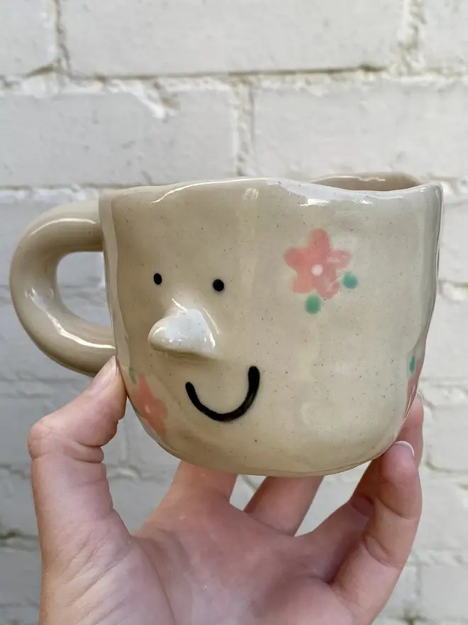 pink flower painted handmade ceramic smiley face mug