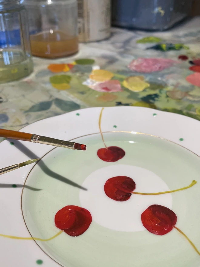 painting cherries in the studio