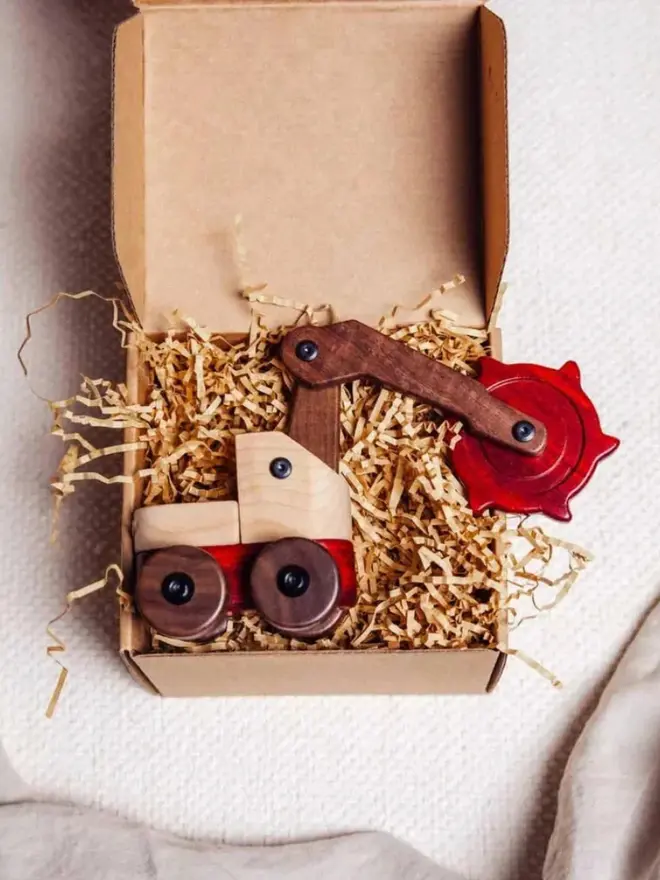 Walnut & Padauk Digger Wood Heirloom Toy, packaging. 