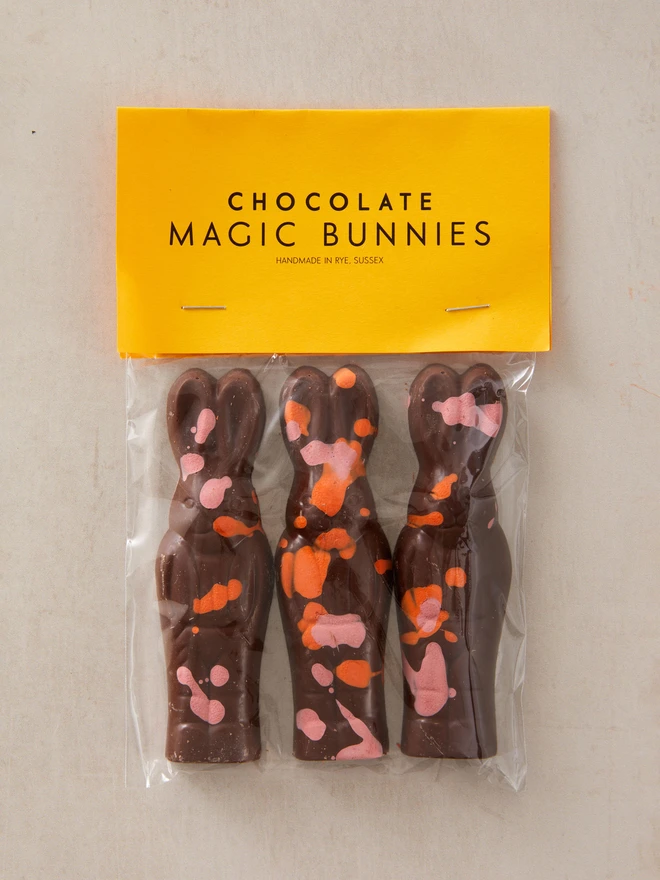 magic chocolate bunnies. a pack of three chocolate bunny rabbits in plastic packaging.