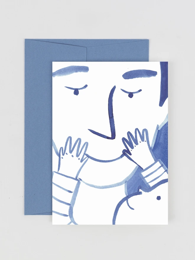 A card featuring an ink illustration of a baby holding onto their Father's face. They are smiling at each other
