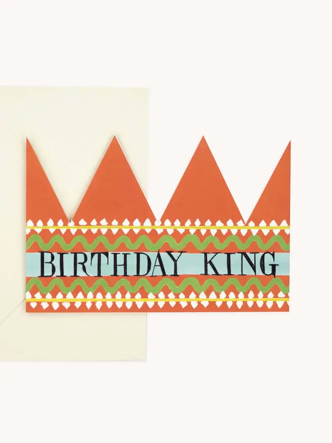 red paper crown card with birthday king text