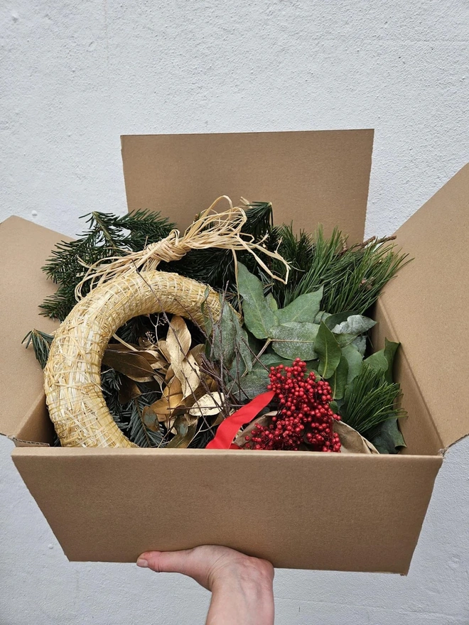 cardboard box with wreath kit components