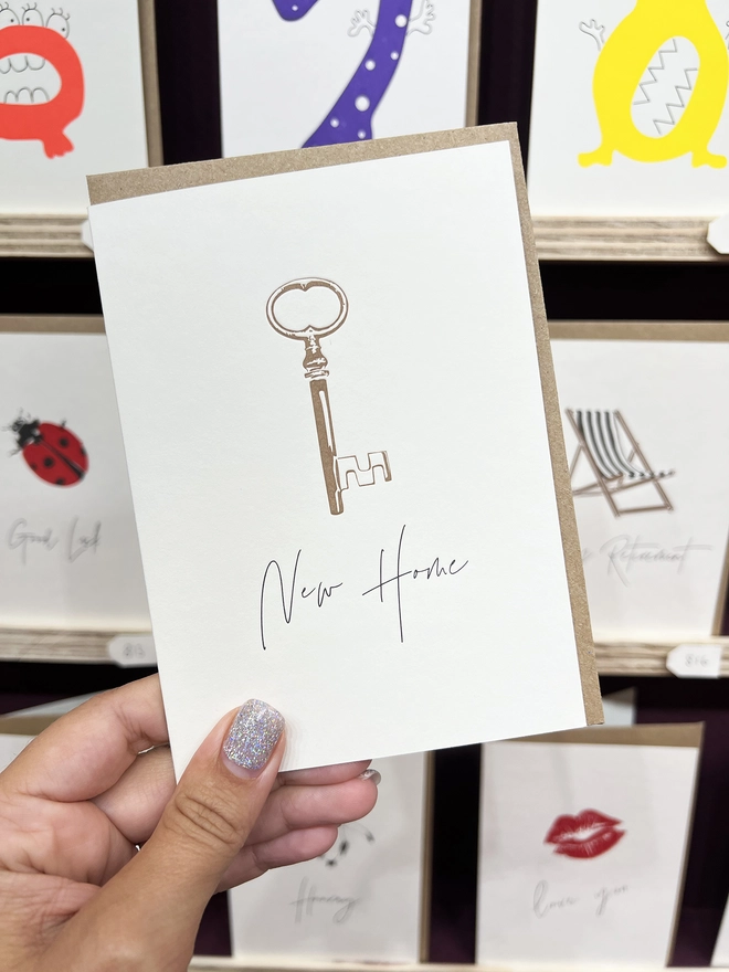 The New home card in front of the other cards we offer in our occasionally handwritten collection.