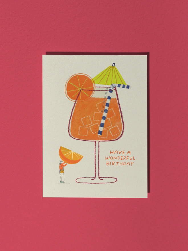 Aperol Spritz Cocktail Card with cocktail umbrella, orange slice and character interacting with the glass holding up an orange slice 
