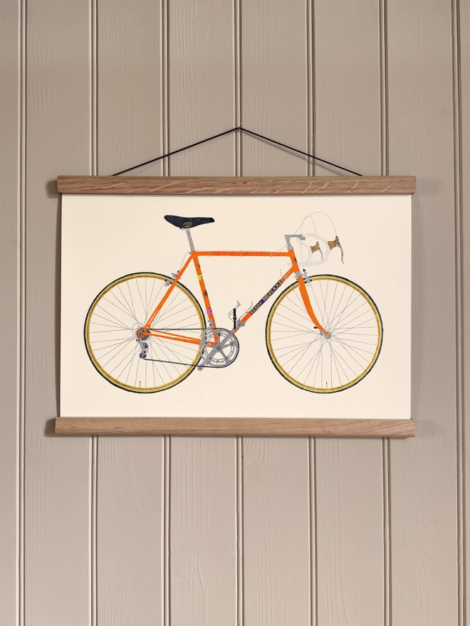 Vintage Orange Bicycle print, framed, on a wall