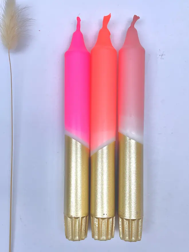 3 pink and gold candles