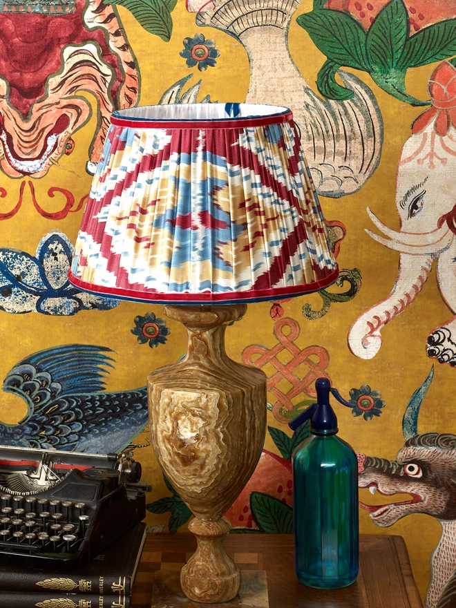 Handmade Red-Blue Silk Ikat Lampshade in a Yellow-Styled Patterned Wallpapered Room