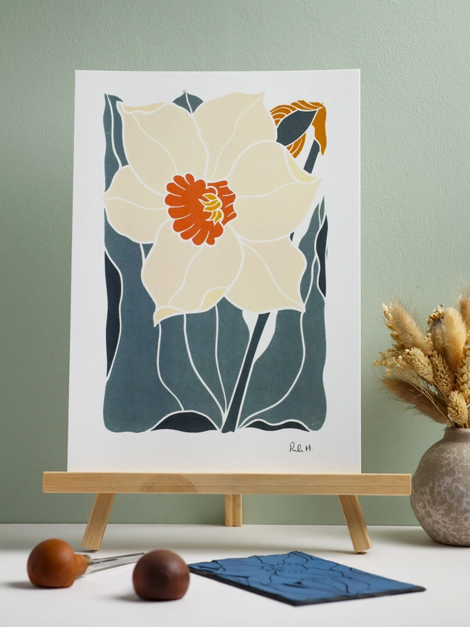 A bold white daffodil linocut art print, the perfect gift for Mother's Day and March birthdays.