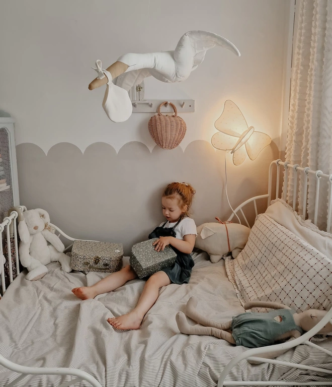 Flying Stork Hanging Decoration, a hanging stork decoration suspended in a child's bedroom. 