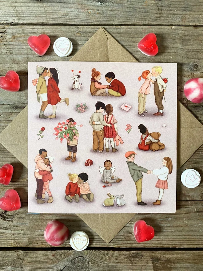 valentines day card illustrated with little children card surrounded by sweets