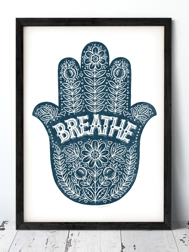 blue breathe yoga hand print in a black frame