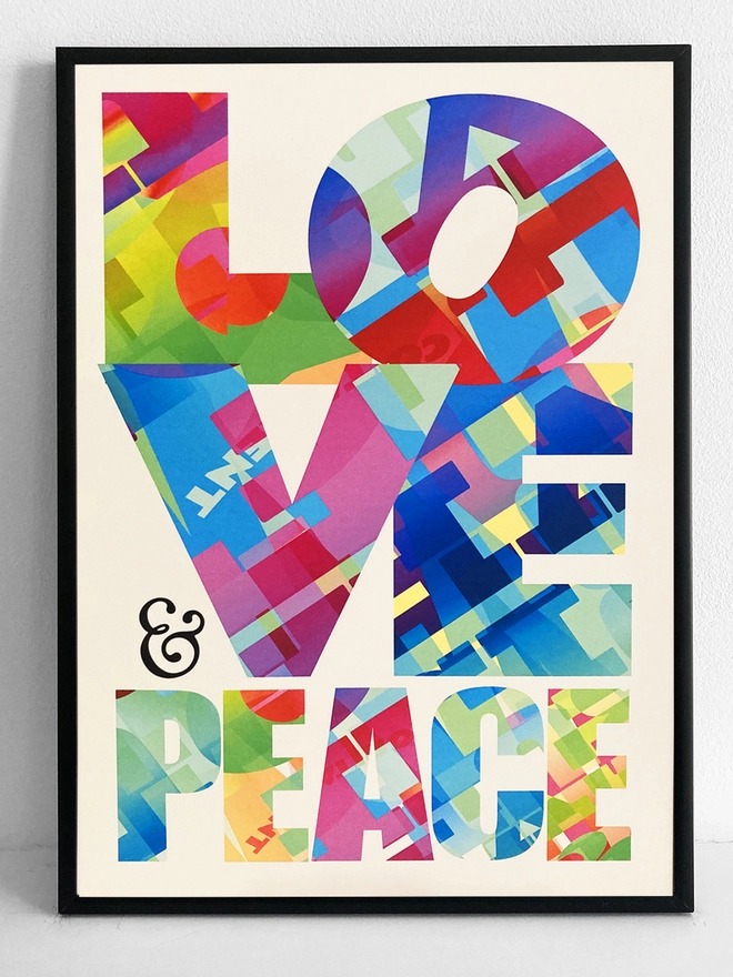 Framed multicoloured typographic print of “Peace & Love”