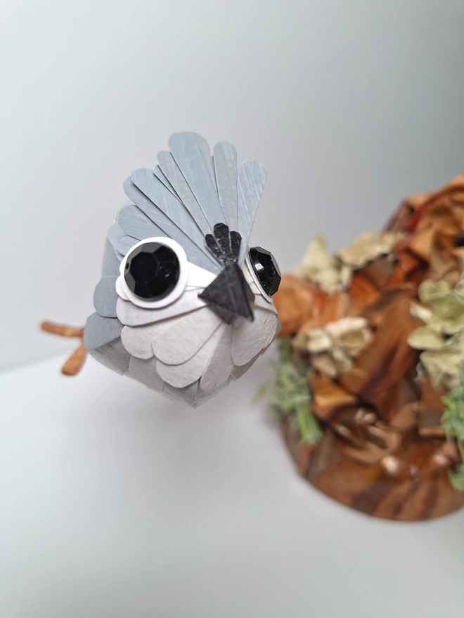 Tufted Titmice on a trees tump handmade bird sculpture