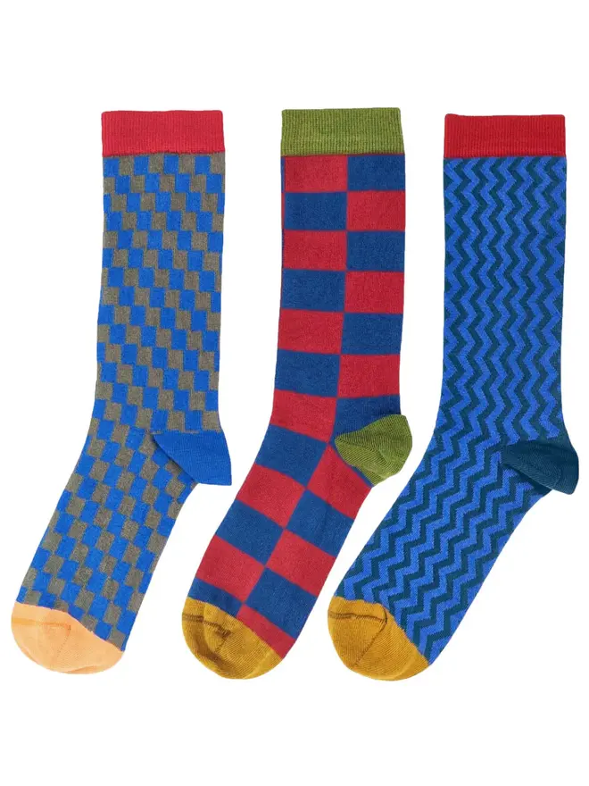 Men's Organic Cotton Ankle Socks Packs (Sets Of 3), a set of colourful patterned socks sitting on a plain white surface. 