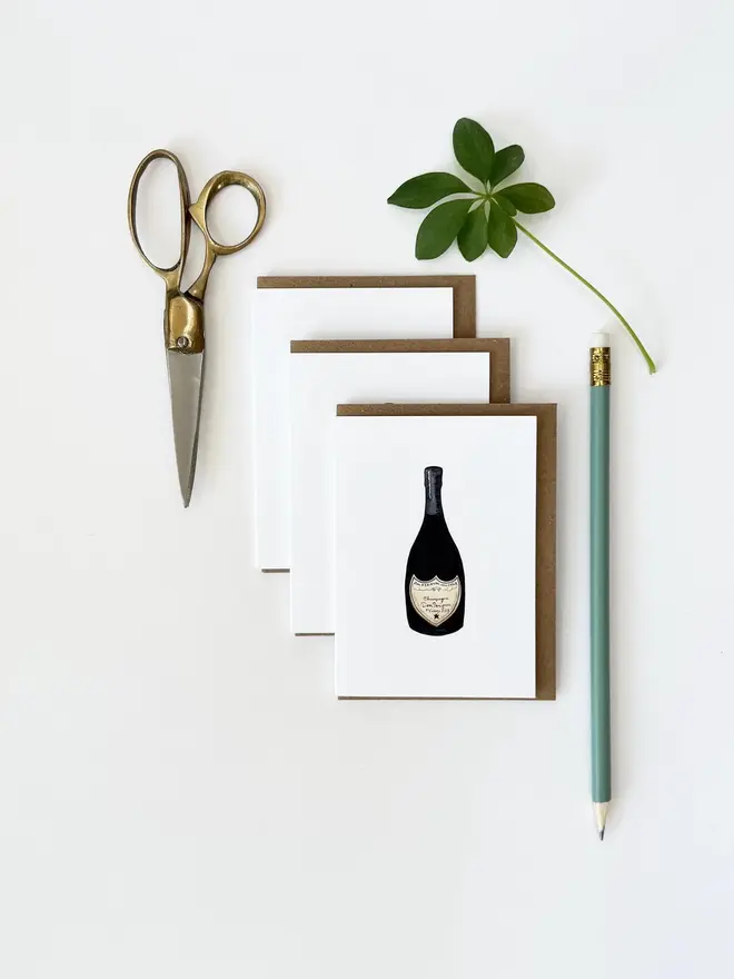 champagne bottle illustrated mini cards (pack of 3). 3 overlapping cards photographed on white background.
