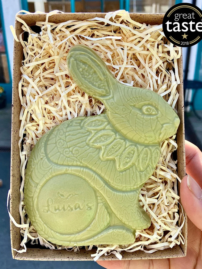 Vegan Matcha Chocolate Luigi Bunny – Limited Edition being held up showing a Great Taste award
