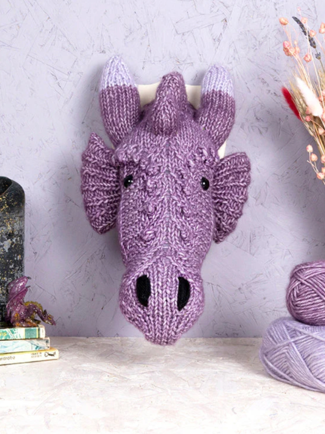 Dragon Head Knit Kit. A mini purple dragon head.