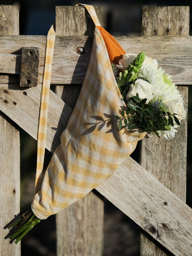 reusable linen flower bag in spring coloured gingham for gifting and shopping