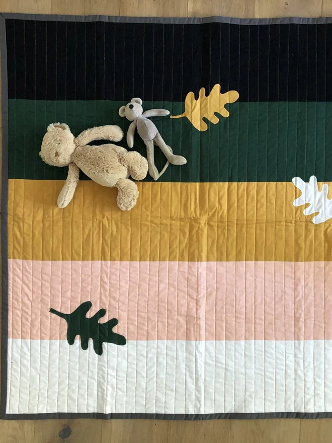 Autumn Leaf Stripe Cotton Baby Quilt/ Mat. A multicoloured stripe leaf design baby mat.