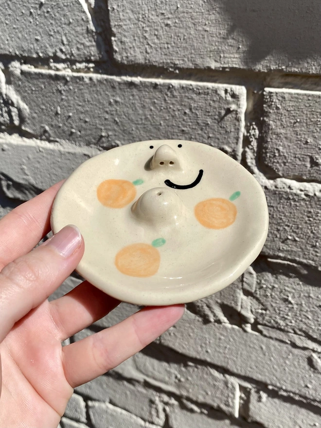 orange incense dish