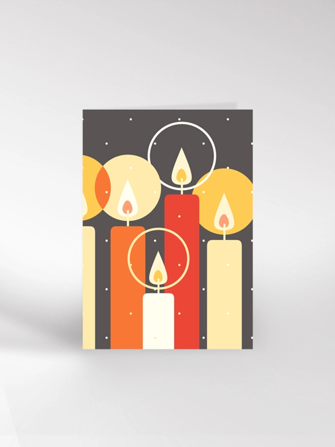 Contemporary illustrated Christmas card featuring brightly coloured lighted candles