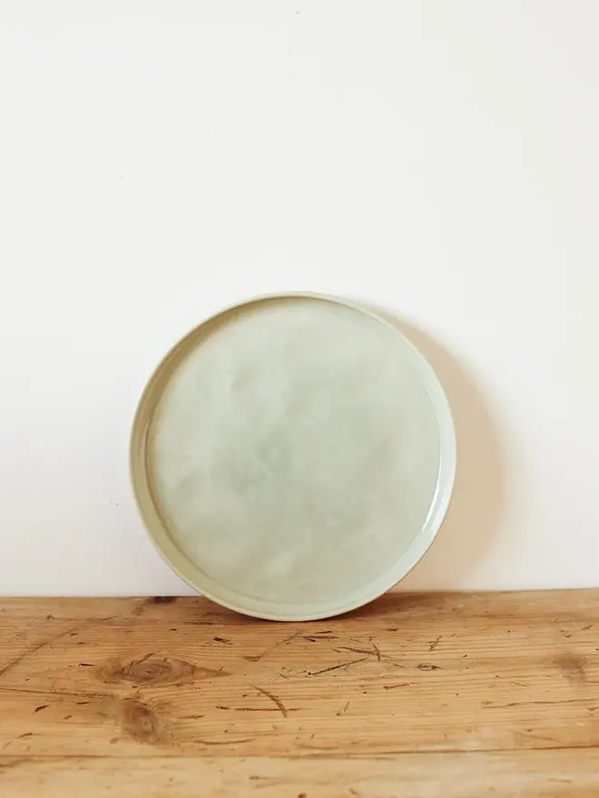 small stoneware plates (set of 2). a round plate in sea green.